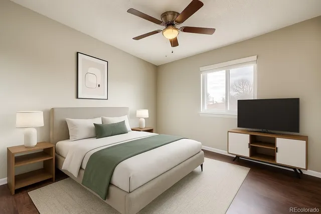 a bedroom with a bed and a flat screen tv