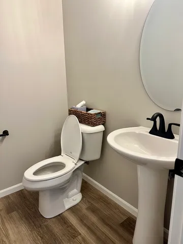 a bathroom with a toilet and a sink