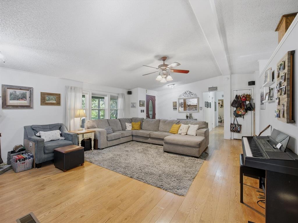 3275 Finis Road Graham, TX 76450 - Photo 8 of 36 a living room with furniture and wooden floor