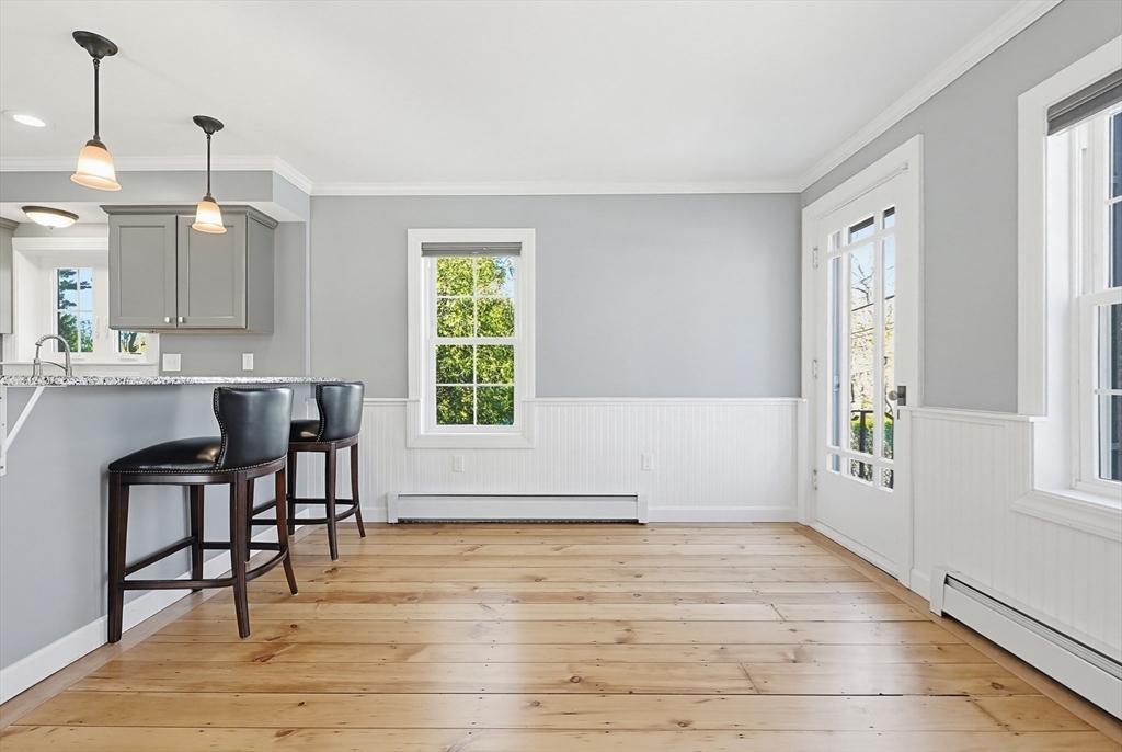 44 Clark Street Spencer, MA 01562 - Photo 15 of 41 a view of a kitchen with wooden floor and a window