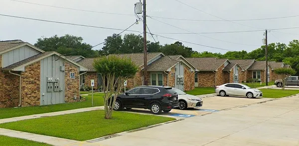 a view of a car parked in front of house
