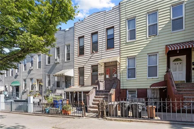a front view of a building with street view