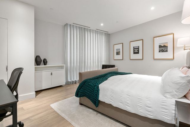 a bathroom with a double vanity sink and mirror