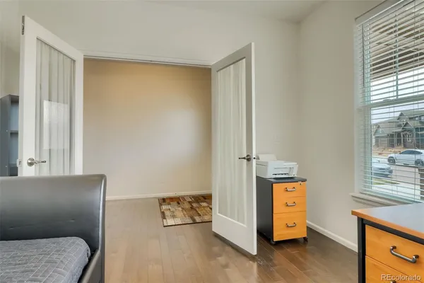 a view of room with furniture and wooden floor