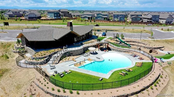 a view of a swimming pool with a table and chairs