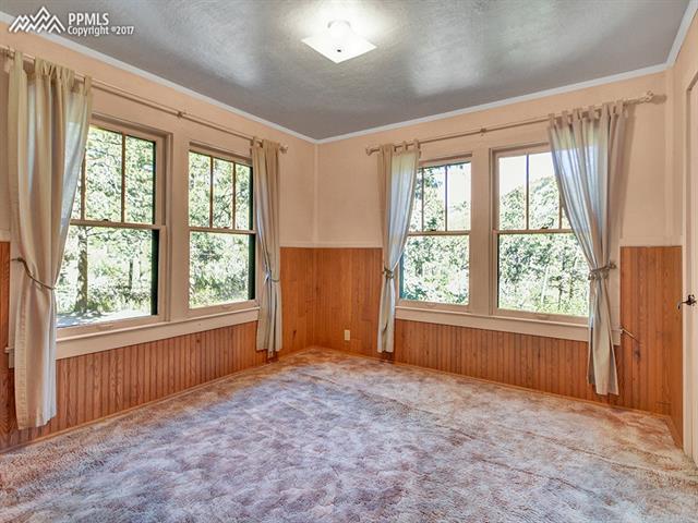 9395 Ute Road Cascade, CO 80809 - Photo 7 of 35 Open and bright bedroom