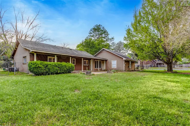 a front of a house with a garden