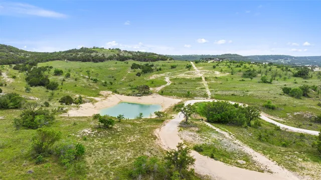 a view of lake with green space