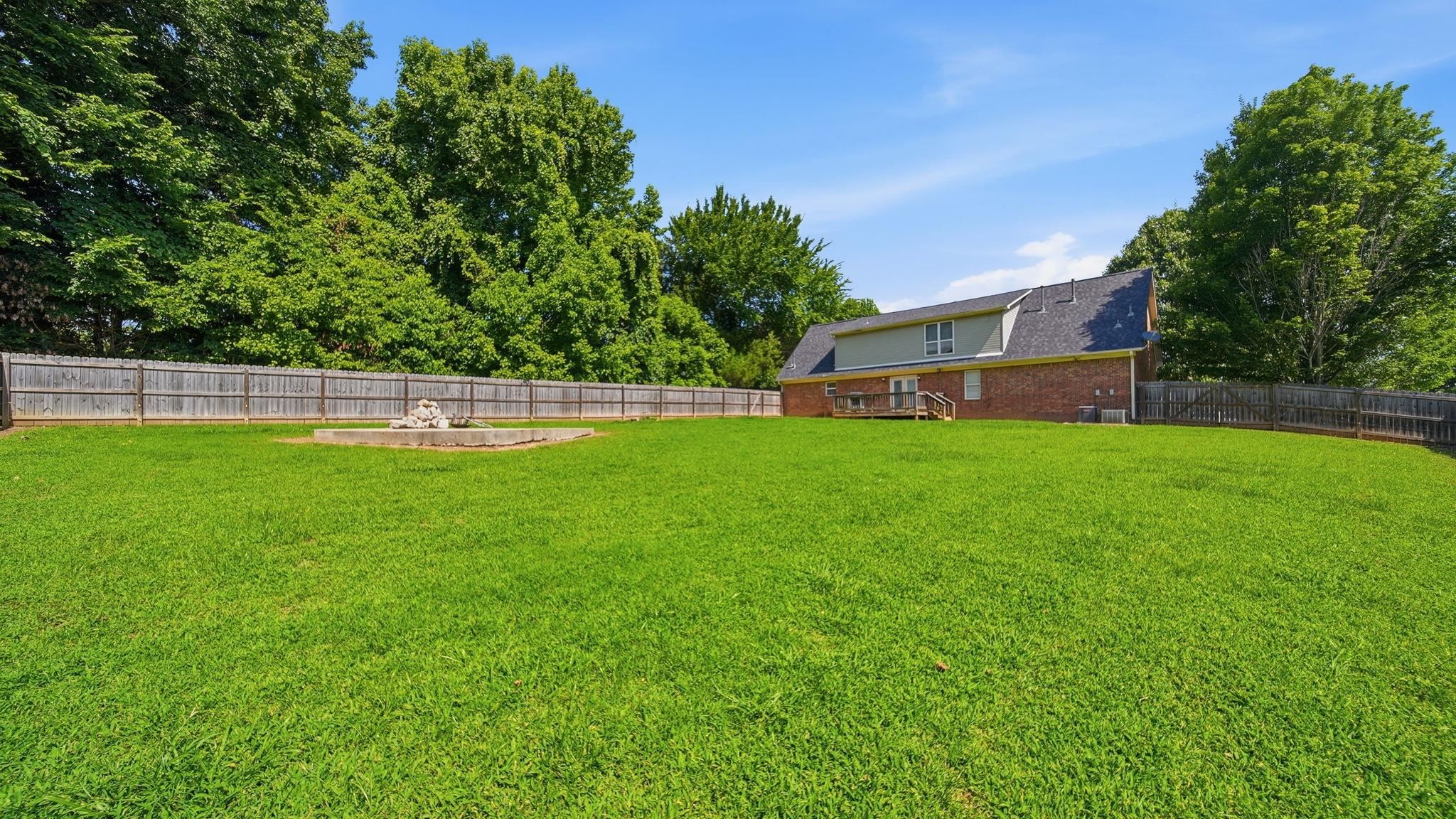 217 Rae Drive Munford, TN 38058 - Photo 39 of 40 Expansive fenced backyard featuring a substantial lawn.