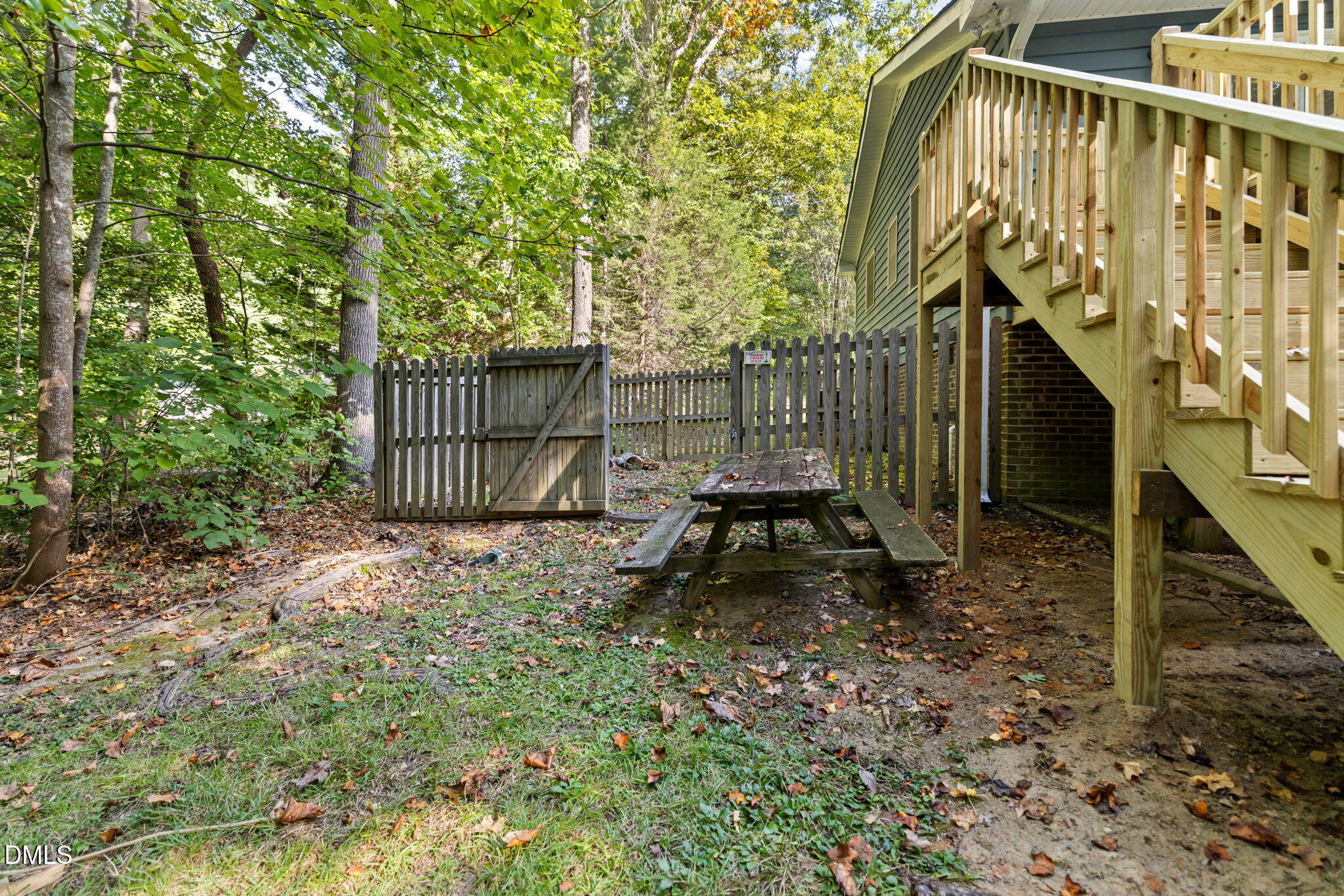 1873 Mill Creek Road Clarksville, VA 23927 - Photo 9 of 50 a view of a backyard with a trees and wooden fence