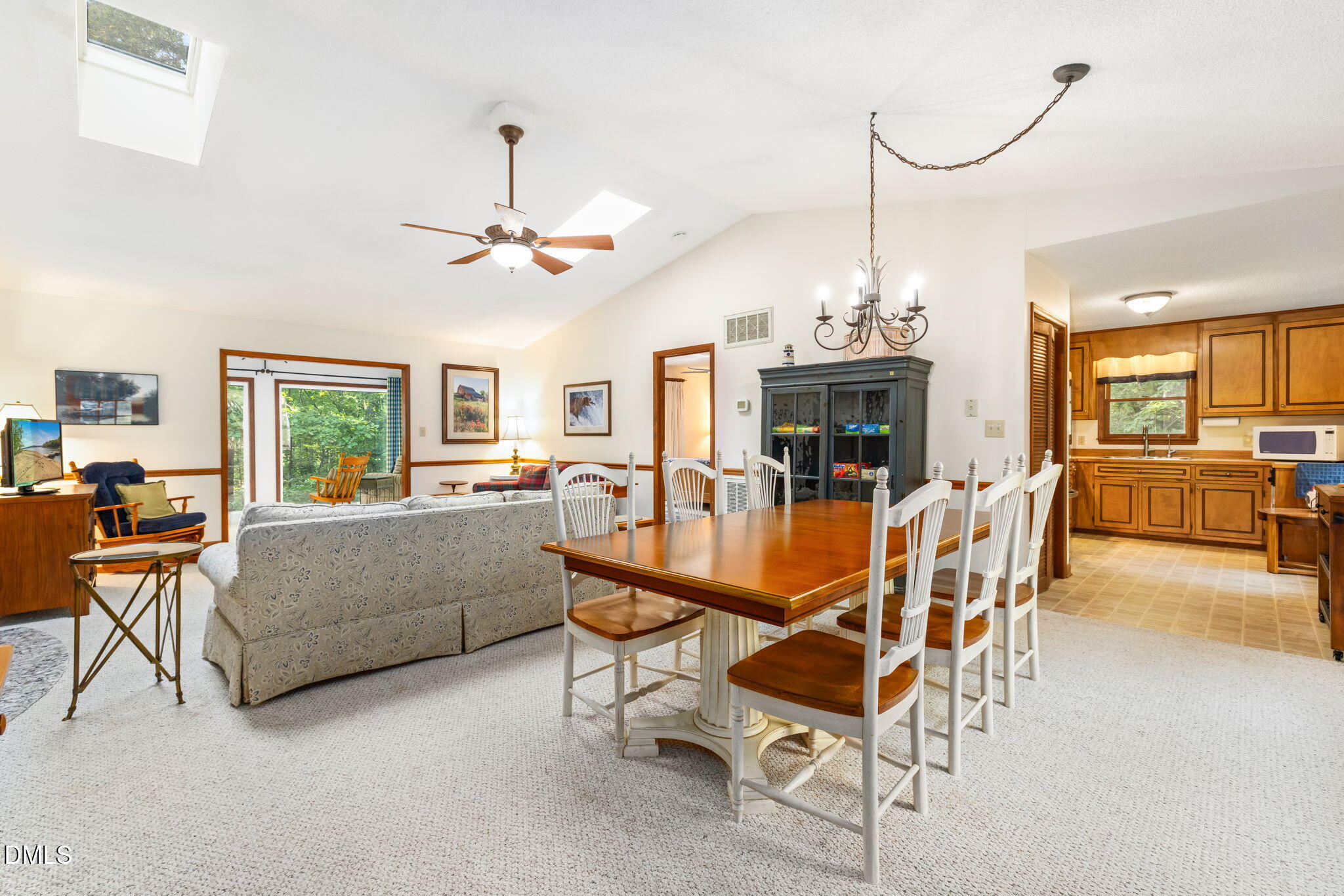 1873 Mill Creek Road Clarksville, VA 23927 - Photo 24 of 50 a dining room with furniture a chandelier and window