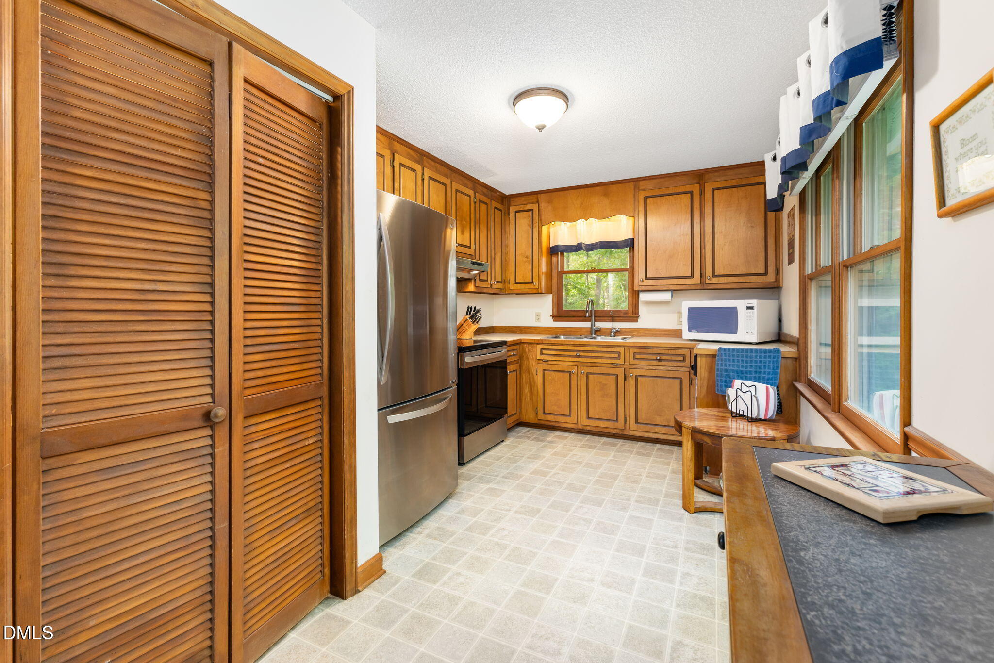 1873 Mill Creek Road Clarksville, VA 23927 - Photo 28 of 50 a kitchen with stainless steel appliances granite countertop a sink and cabinets