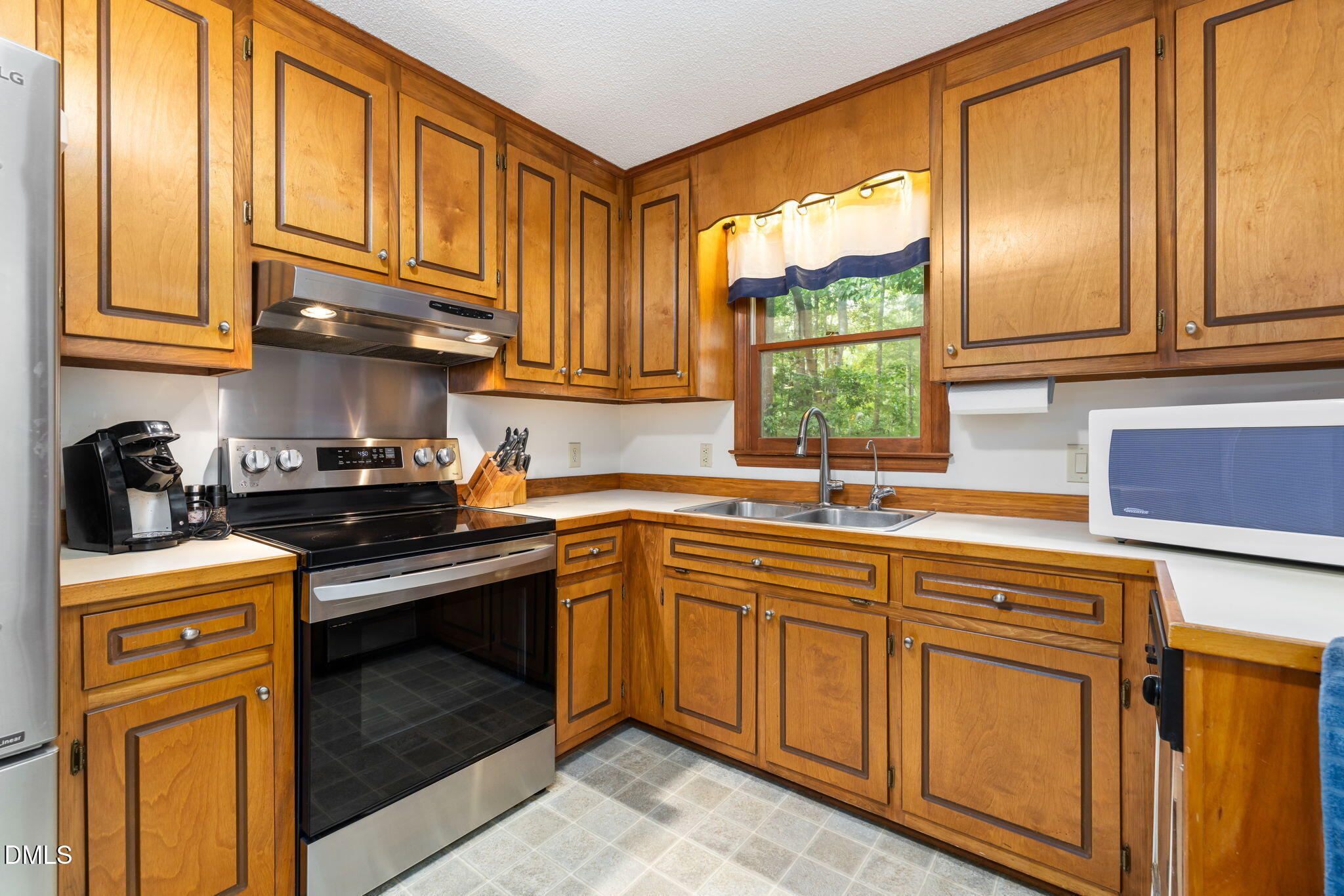 1873 Mill Creek Road Clarksville, VA 23927 - Photo 29 of 50 a kitchen with stainless steel appliances granite countertop a sink and cabinets