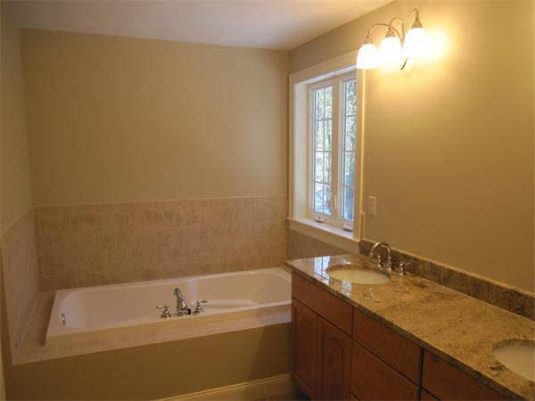 10 July Sudbury, MA 01776 - Photo 6 of 7 a bathroom with a granite countertop sink and a bathtub