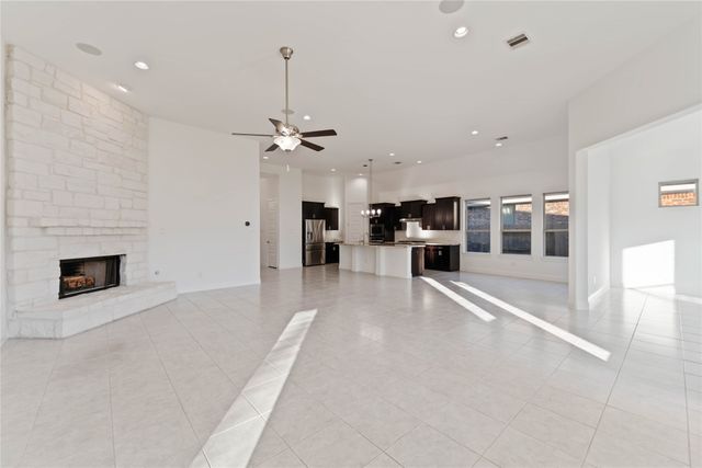 a view of a living room a window and a fireplace