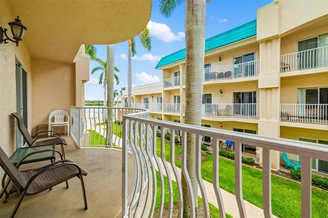 a view of a balcony with chairs