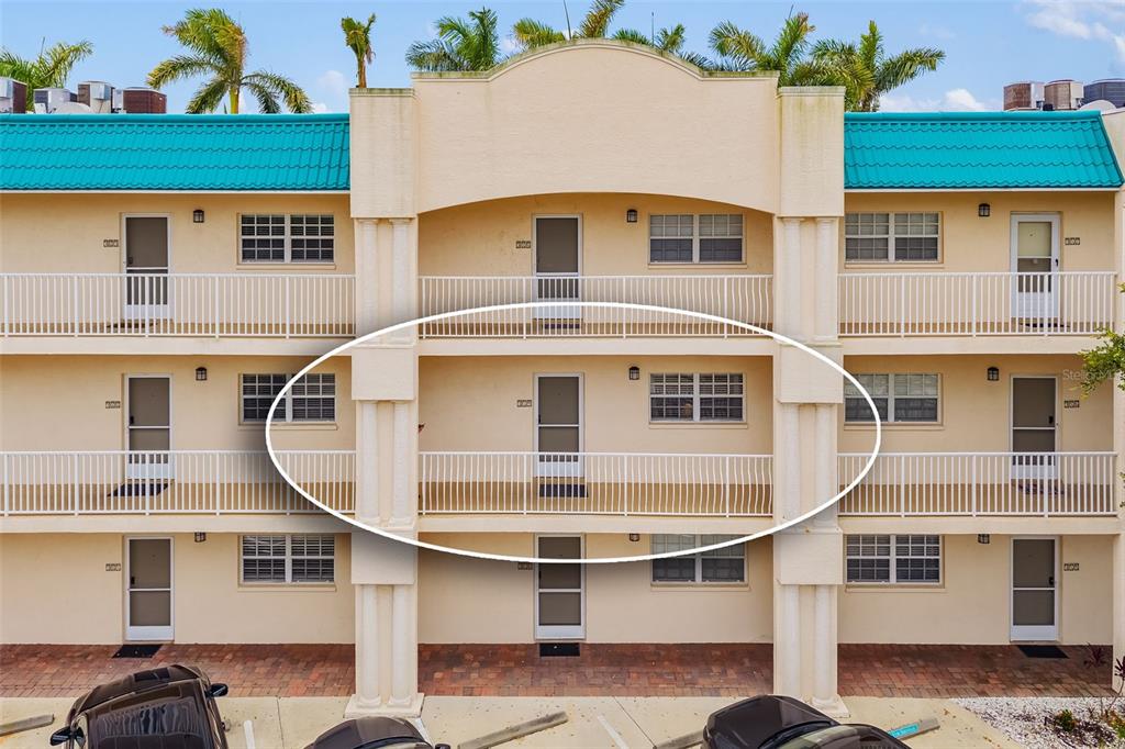5961 Midnight Pass Road, Unit 319 Sarasota, FL 34242 - Photo 4 of 34 a front view of a house with a balcony