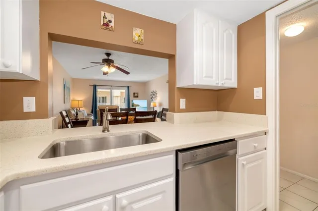 a kitchen with a sink cabinets and a window