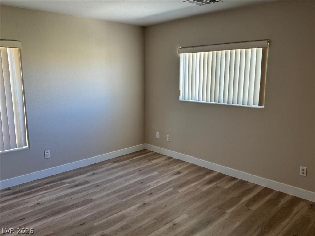 3962 Coyote Ridge Court Las Vegas, NV 89129 - Photo 27 of 35 Enjoy the easy maintenance of wood flooring and naturally illuminated walls, perfect for personalization.