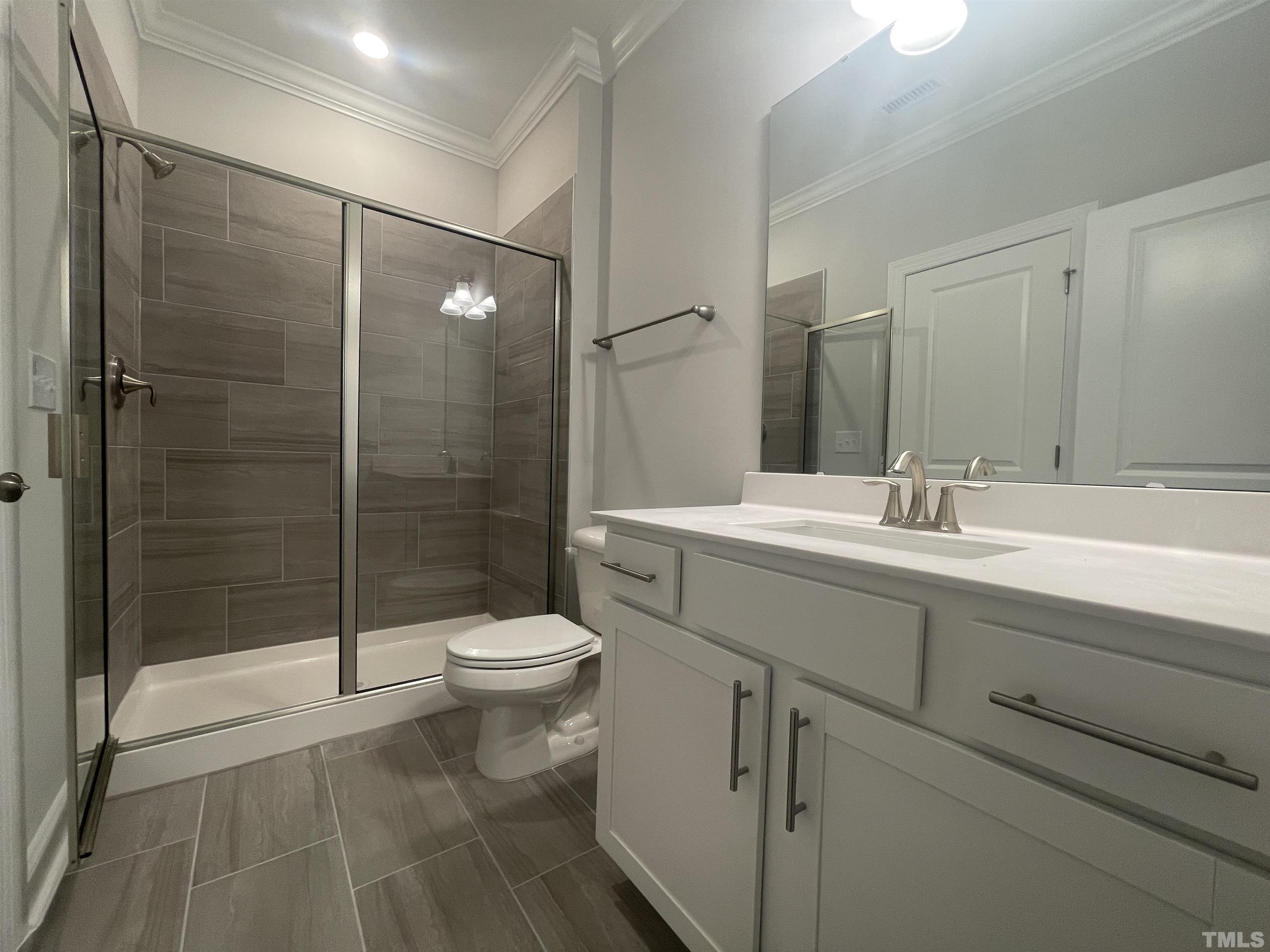 191 Edge Of Auburn Boulevard Raleigh, NC 27610 - Photo 7 of 24 a bathroom with a sink toilet and shower