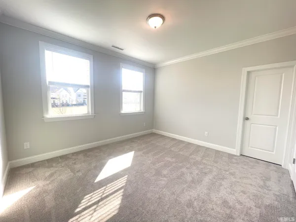 a view of an empty room and a window