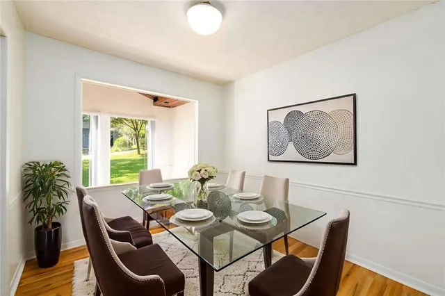 a view of a dining room with furniture and window