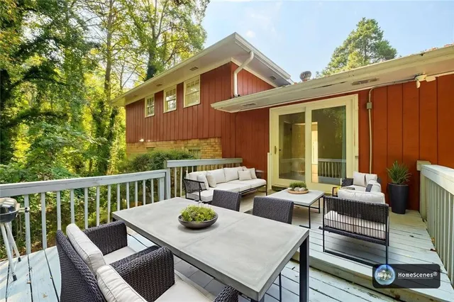 a view of a patio with wooden floor