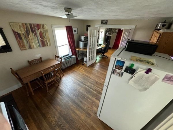 169 Main Street, Unit 1 Avon, MA 02322 - Photo 2 of 12 a living room with furniture and a flat screen tv