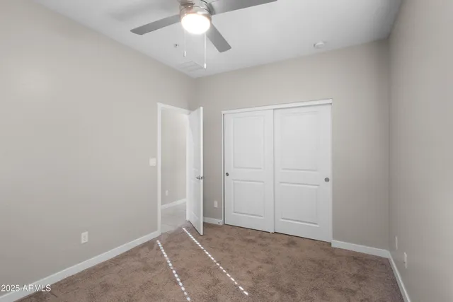 an empty room with fan