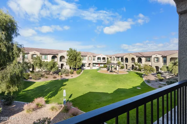 a view of swimming pool from outdoor seating area