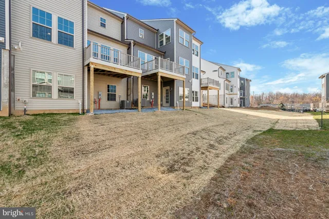 a view of a building with a yard