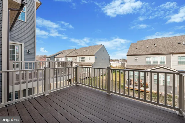 a view of balcony with wooden floor