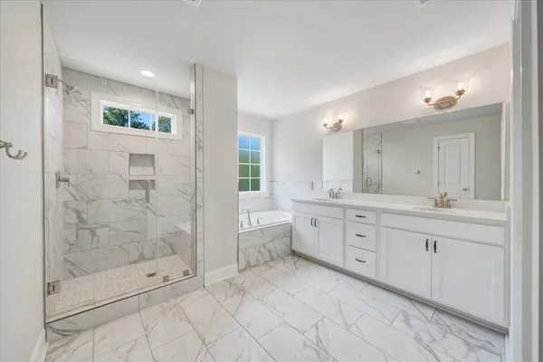 a view of a room with wooden floor and white walls