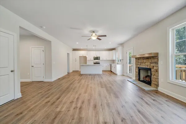 wooden floor in an empty room with a fireplace