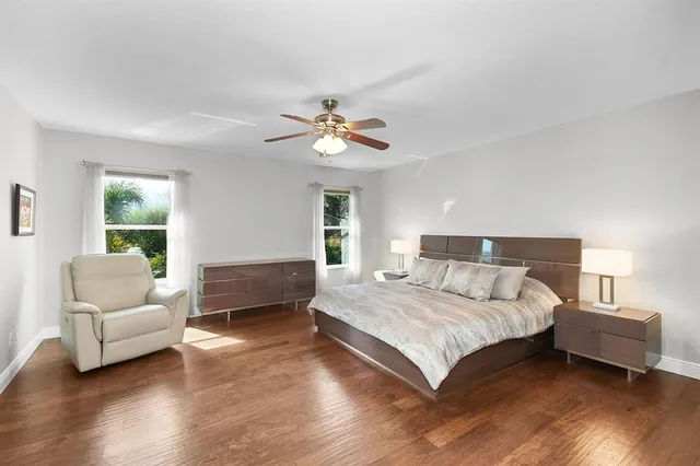 a bedroom with a bed couch and a window