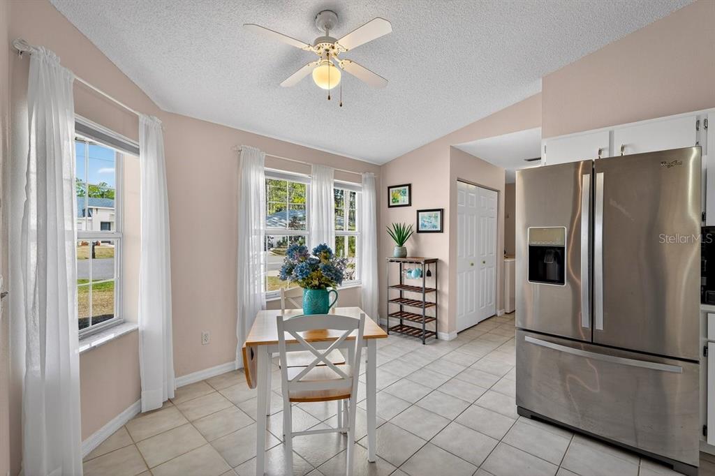 18 Smoke Tree Place Palm Coast, FL 32164 - Photo 11 of 34 a kitchen with stainless steel appliances granite countertop a refrigerator and a stove top oven