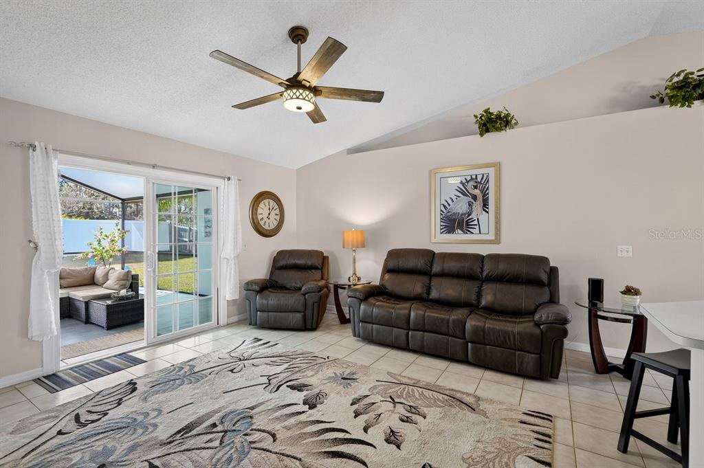 18 Smoke Tree Place Palm Coast, FL 32164 - Photo 15 of 34 a living room with furniture ceiling fan and a window