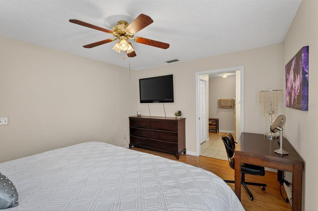 18 Smoke Tree Place Palm Coast, FL 32164 - Photo 20 of 34 a bedroom with a bed and a desk