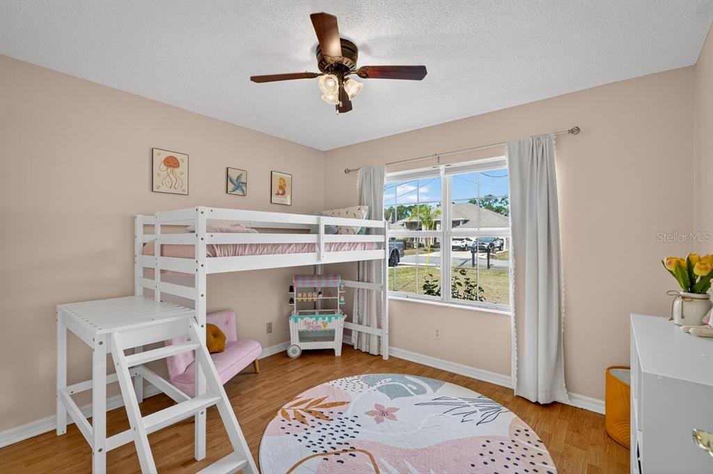 18 Smoke Tree Place Palm Coast, FL 32164 - Photo 25 of 34 a bed room with a bed and a window