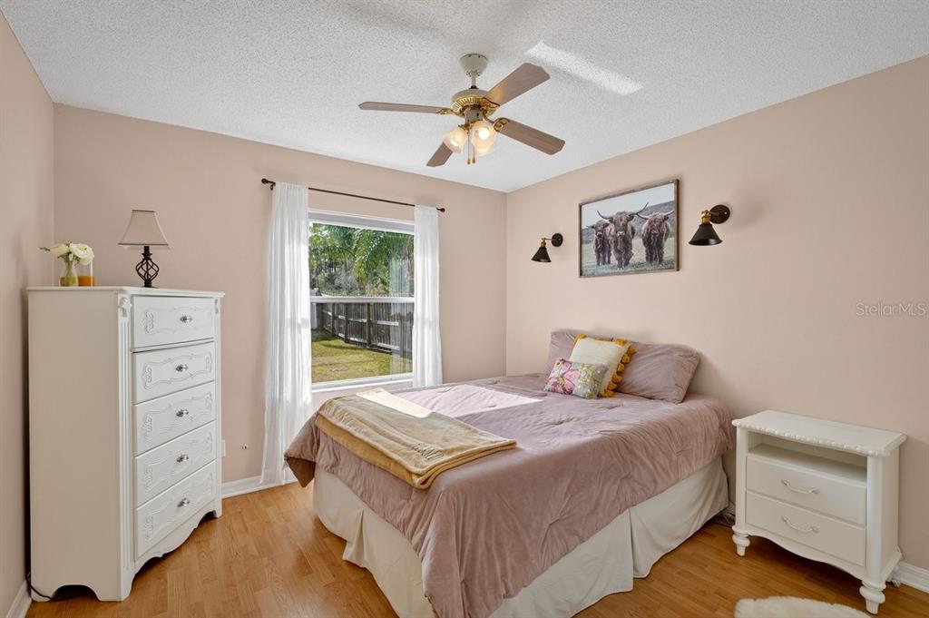 18 Smoke Tree Place Palm Coast, FL 32164 - Photo 28 of 34 a bedroom with a bed and a dresser