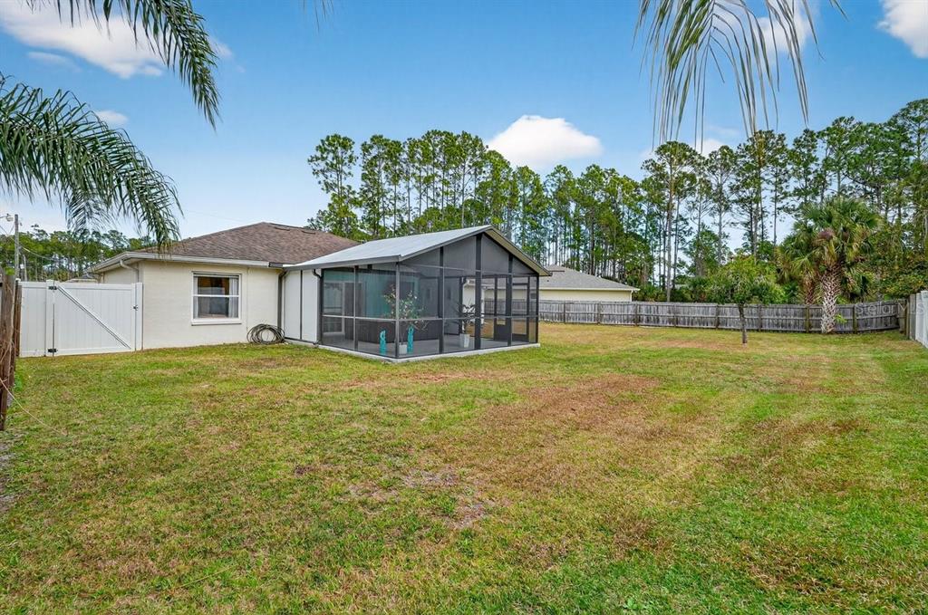 18 Smoke Tree Place Palm Coast, FL 32164 - Photo 34 of 34 a house with swimming pool in front of it