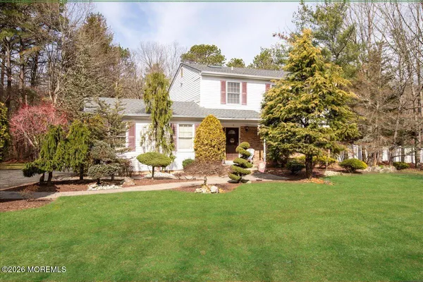a view of a house with backyard