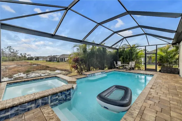 a view of swimming pool with a yard