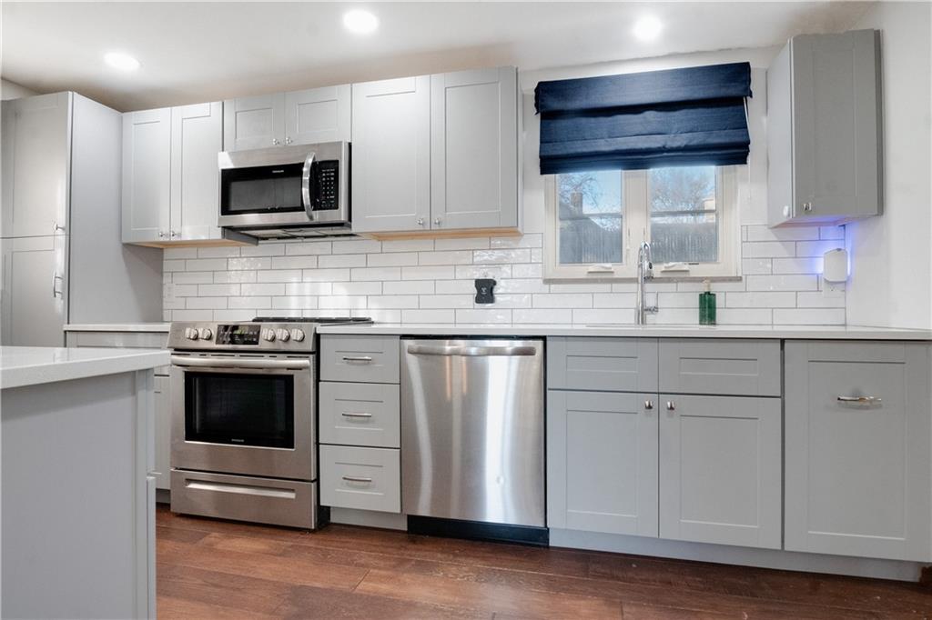 406 Bower Hill Road Pittsburgh, PA 15228 - Photo 14 of 26 a kitchen with stainless steel appliances white cabinets and a sink