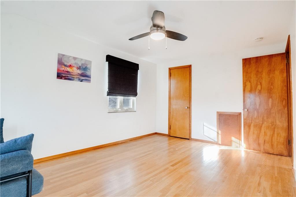 406 Bower Hill Road Pittsburgh, PA 15228 - Photo 17 of 26 a view of an empty room with wooden floor and a window