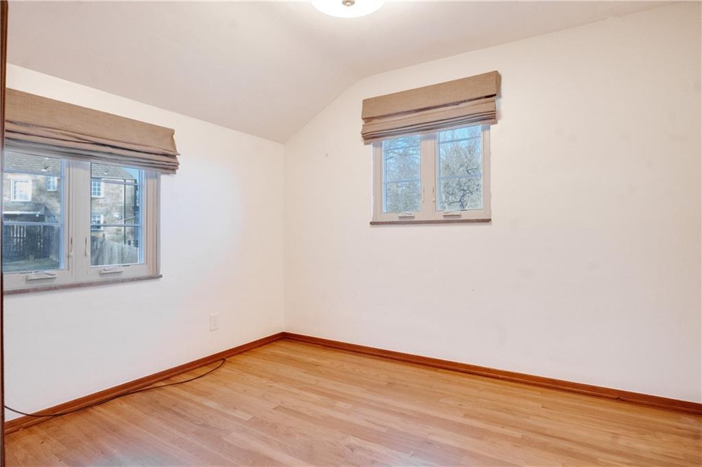 406 Bower Hill Road Pittsburgh, PA 15228 - Photo 19 of 26 a view of an empty room with wooden floor and a window