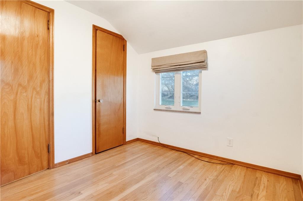 406 Bower Hill Road Pittsburgh, PA 15228 - Photo 20 of 26 a view of an empty room with wooden floor and a window