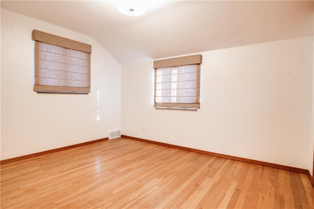 406 Bower Hill Road Pittsburgh, PA 15228 - Photo 21 of 26 an empty room with wooden floor and windows
