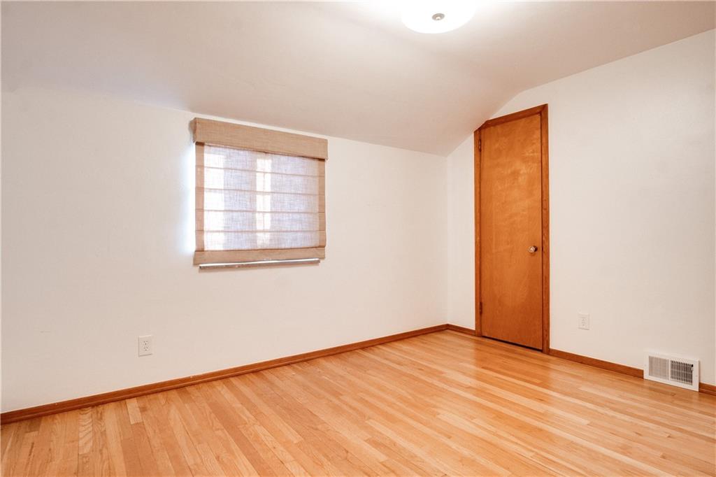 406 Bower Hill Road Pittsburgh, PA 15228 - Photo 22 of 26 an empty room with wooden floor and windows