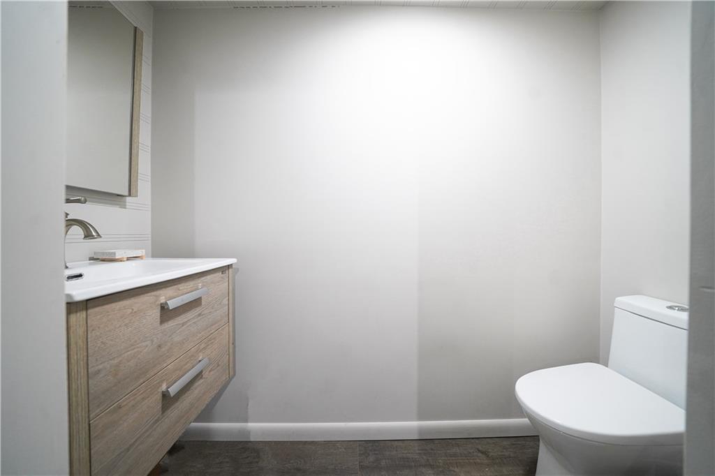 406 Bower Hill Road Pittsburgh, PA 15228 - Photo 24 of 26 a bathroom with a toilet sink and mirror